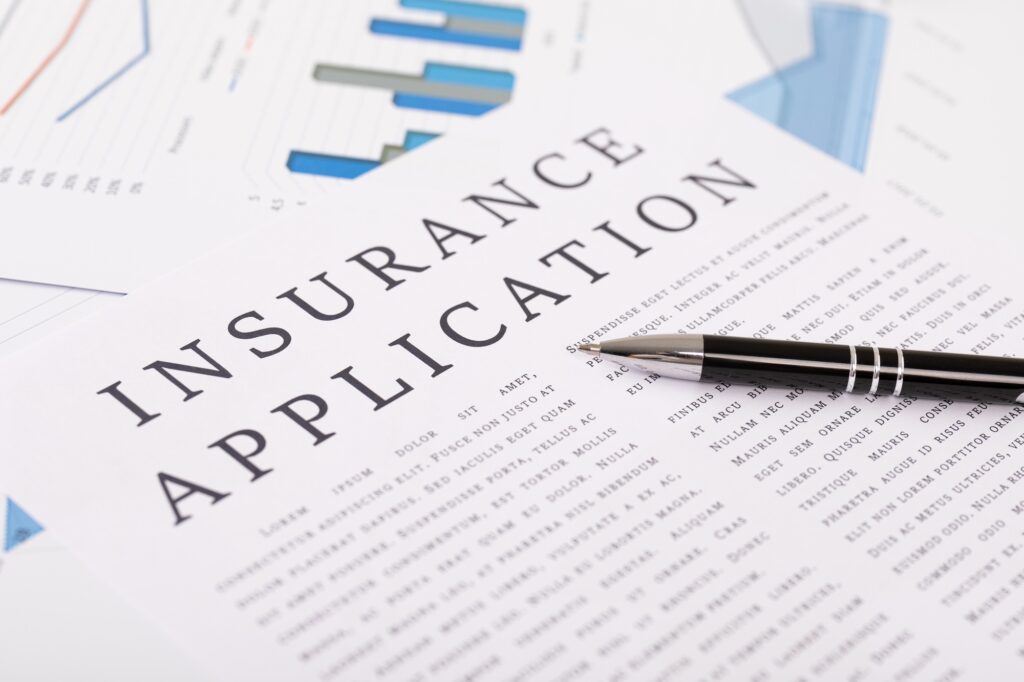 insurance application concept, documents on the desktop